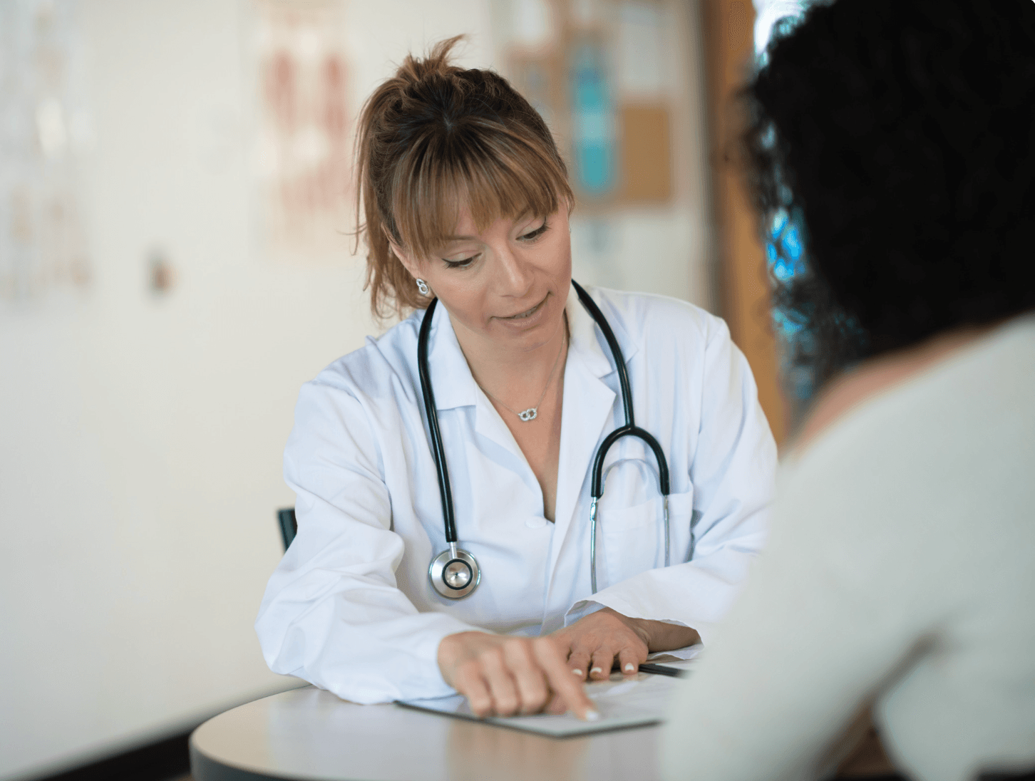 Doctor consulting with patient